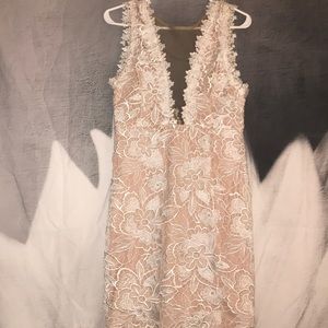 Mini fitted white lace dress with sheer front